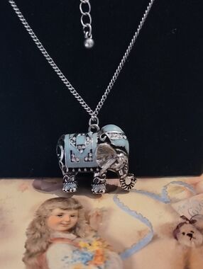 Silver Elephant Pendant Necklace with Light Blue Enamel